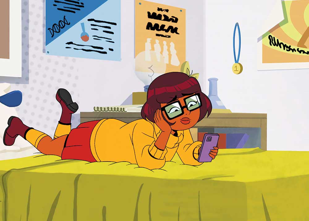 Velma on HBO Canada. Pictured: Velma scolling on her phone.