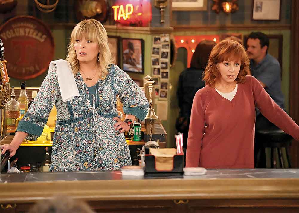 Happy’s Place on CTV and NBC. Pictured: Reba McEntire reunites with her good pal and erstwhile Reba co-star Melissa Peterman on another wholesome, throwback TV comedy.