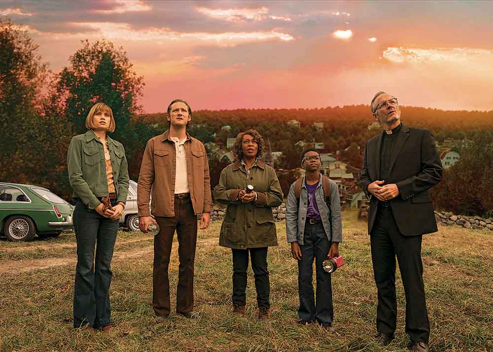 Salem’s Lot on Crave. Pictured: The would-be saviours of Salem’s Lot assemble (left to right): Susan Norton (Makenzie Leigh), Ben Mears (Lewis Pullman), Dr. Cody (Alfre Woodard), Mark Petrie (Jordan Preston Carter) and Father Callahan (John Benjamin Hickey).