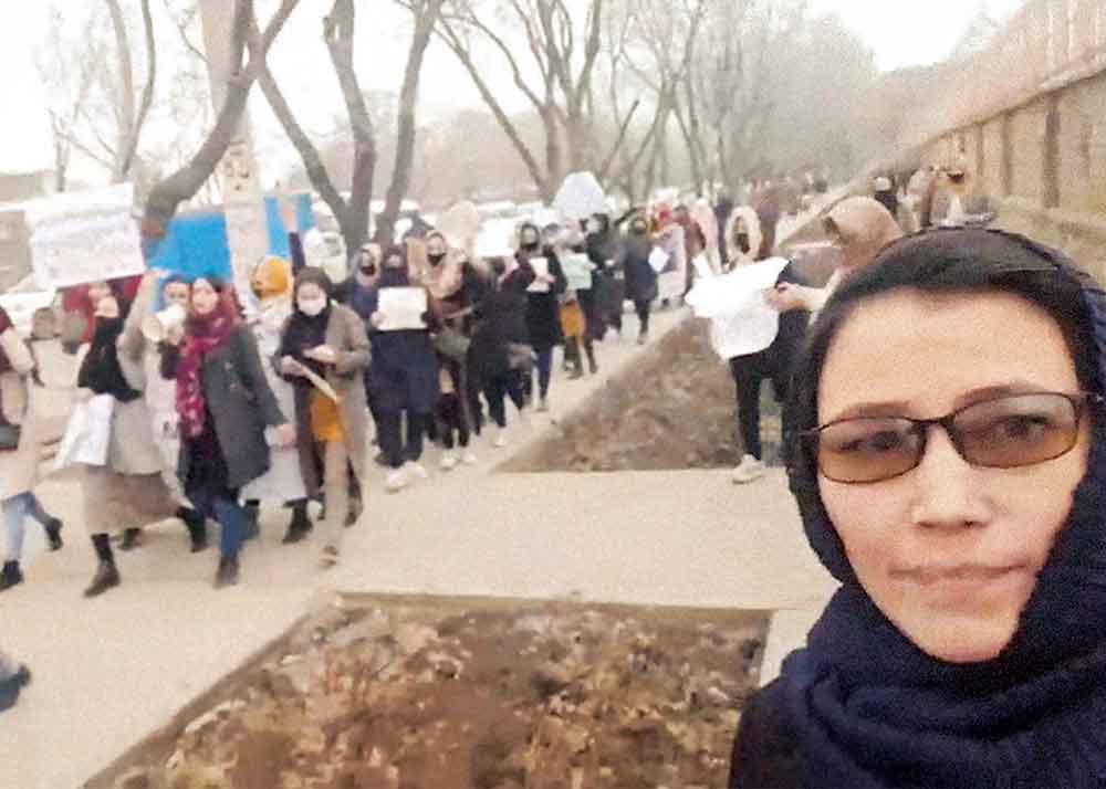 Bread & Roses on Apple TV+. Pictured: A former government employee now denied the right to work by the Taliban, Sharifa Movahidzadeh boldly documents a protest. 