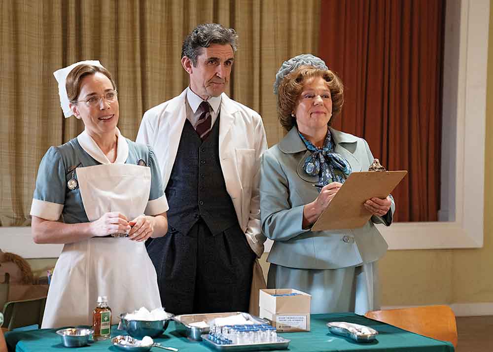 Call the Midwife on PBS. Pictured: Nurse Shelagh Turner (Laura Main), Dr. Patrick Turner (Stephen McGann) and Violet Buckle (Annabelle Apsion).