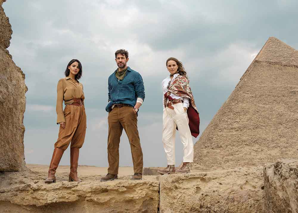 Fountain of Youth on Apple TV+. Pictured (left to right): Mysterious Esme (Eiza González) with siblings Luke (John Krasinski) and Charlotte (Natalie Portman).