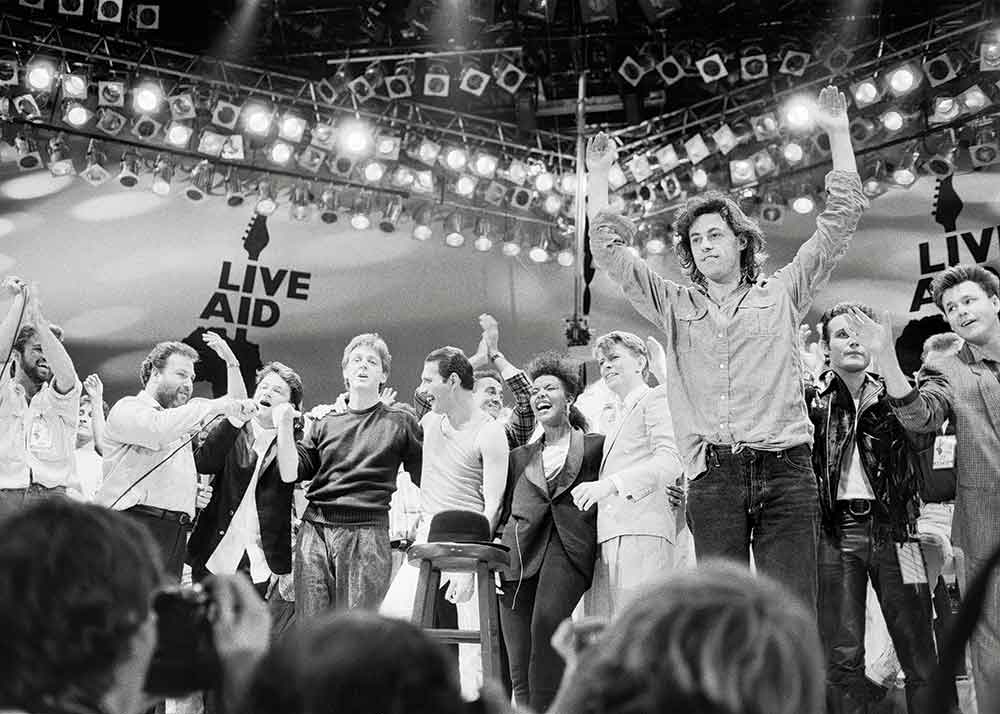 Live Aid: When Rock ’n’ Roll Took Over the World on CNN. Pictured: Live Aid dual venue benefit concert held on 13th July 1985 at Wembley Stadium in London, England, the concerts were organised as a follow up to the Band Aid single 'Do They Know Its Christmas?', the brainchild of Bob Geldof and Midge Ure, to raise money for victims of the famine in Ethiopia; picture shows the performers on stage for the grand finale of the concert at Wembley.