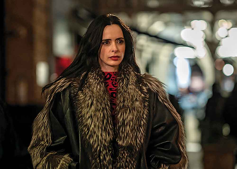 Dexter: Resurrection on Paramount+. Pictured: Krysten Ritter as Mia, one of the murderers invited to the home of Leon Prager.