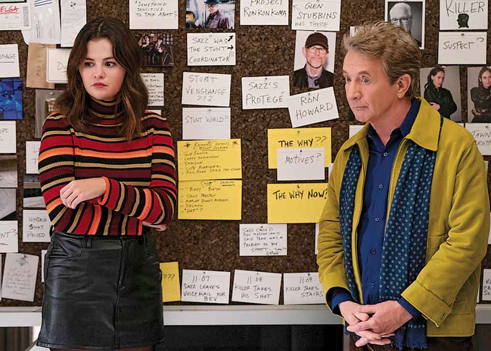 Only Murders in the Building on Disney+. Pictured: Mabel Mora (Selena Gomez) and Oliver Putnam (Martin Short) investigate another murder in the building.