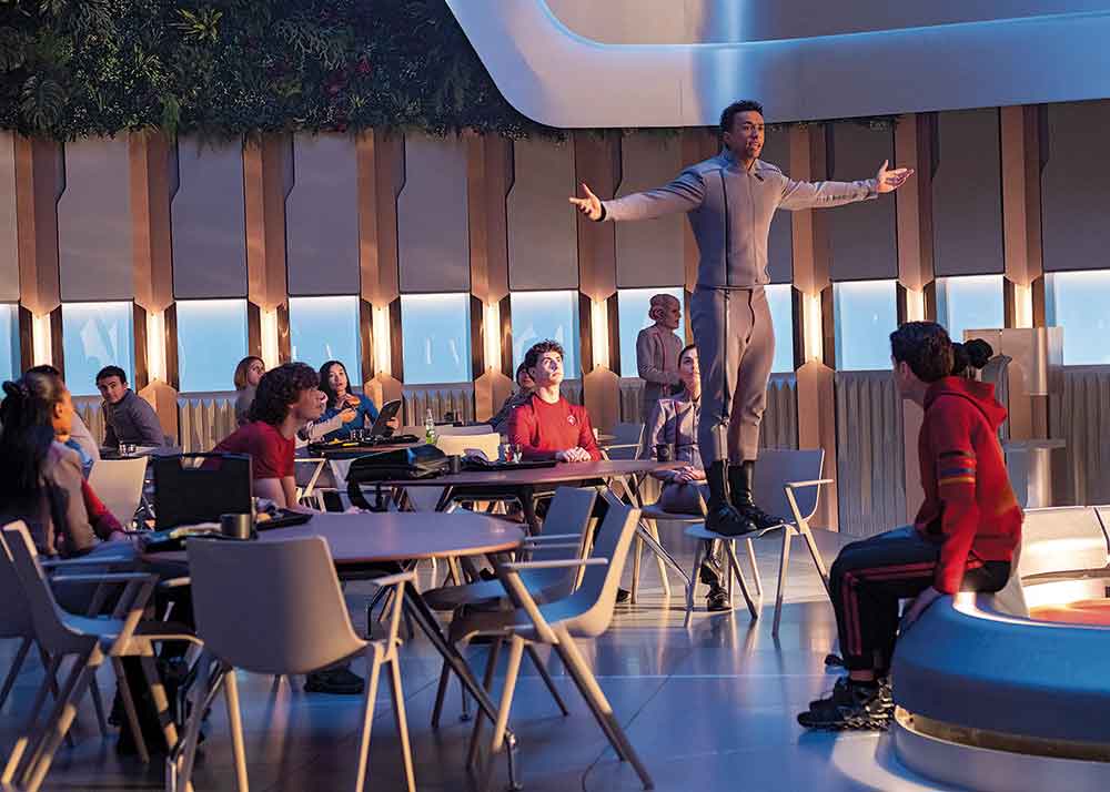 Star Trek: Starfleet Academy on Paramount+. Pictured: Sandro Rosta (standing on chair) is Caleb Mir, who has cut a deal with the chancellor to attend Starfleet Academy if she searches for his missing mother.