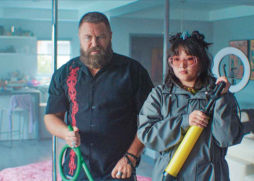 Margo’s Got Money Troubles on Apple TV. Pictured: Margot’s father, Jinx (Nick Offerman) with her roommate Susie (Thaddea Graham).