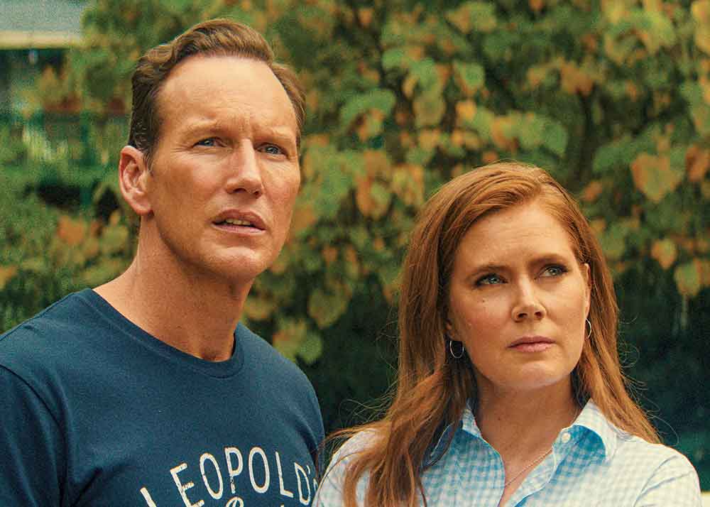 Cape Fear on Apple TV. Pictured: Patrick Wilson and Amy Adams play Tom and Anna Bowden, husband-and-wife attorneys targeted by Max Cady. 