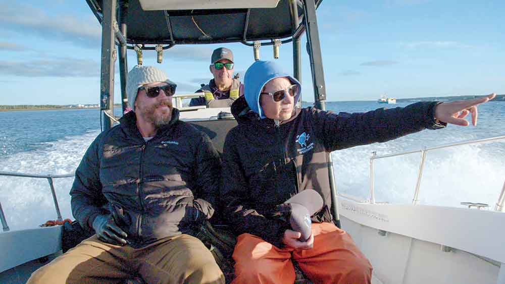 Shark Week on Discovery Channel. Pictured: Dr. Neil Hammerschlag with Paul de Gelder.